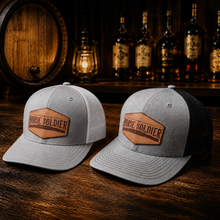 Load image into Gallery viewer, Trucker Hat with Leather Patch | Horse Soldier Bourbon
