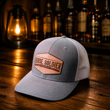 Load image into Gallery viewer, Trucker Hat with Leather Patch | Horse Soldier Bourbon
