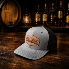 Load image into Gallery viewer, Trucker Hat with Leather Patch | Horse Soldier Bourbon
